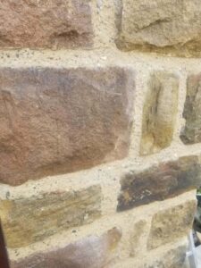 close view of pointing to external stone wall